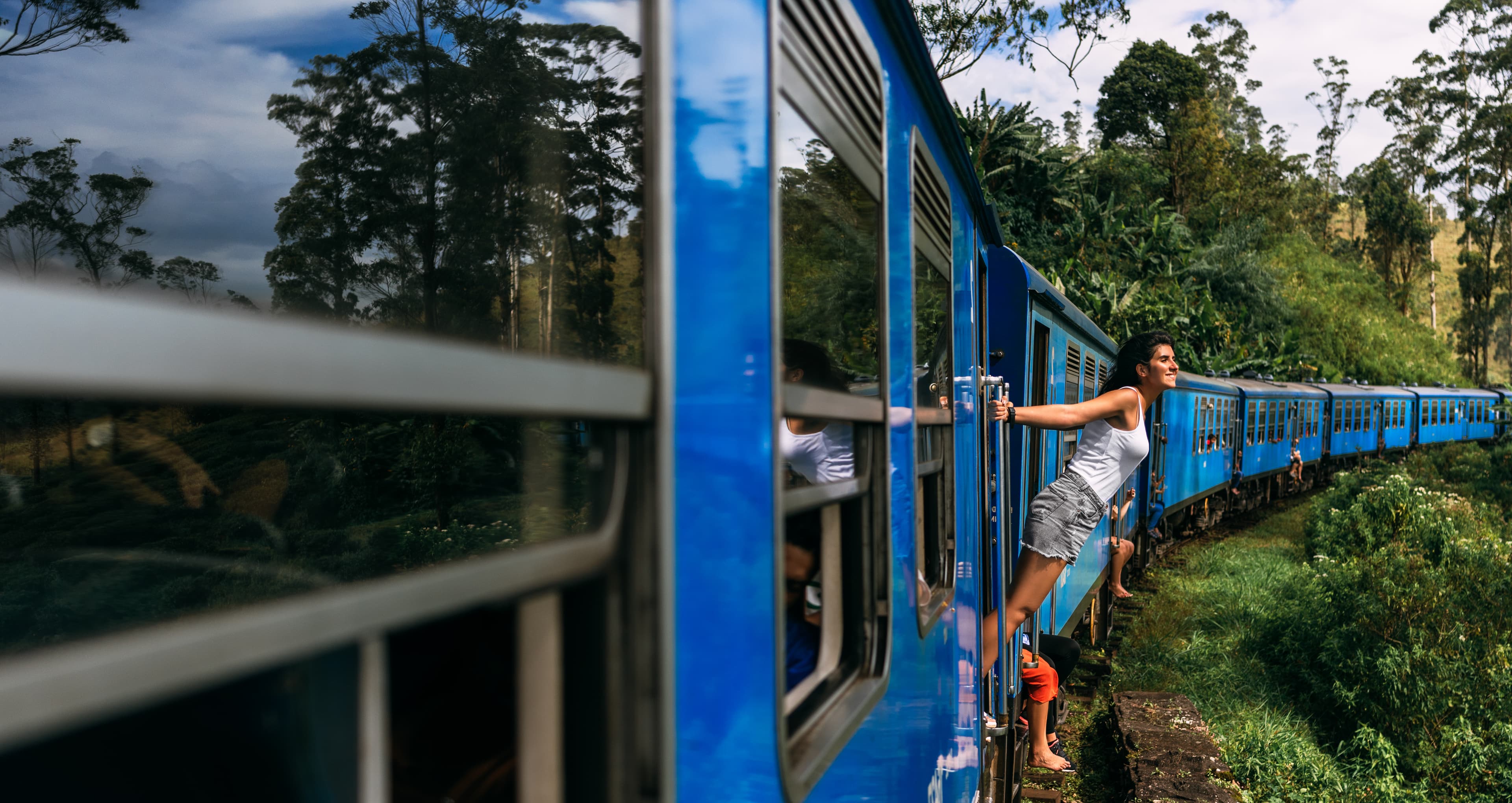 Scenic Sri Lankan train travelling through the green hill country