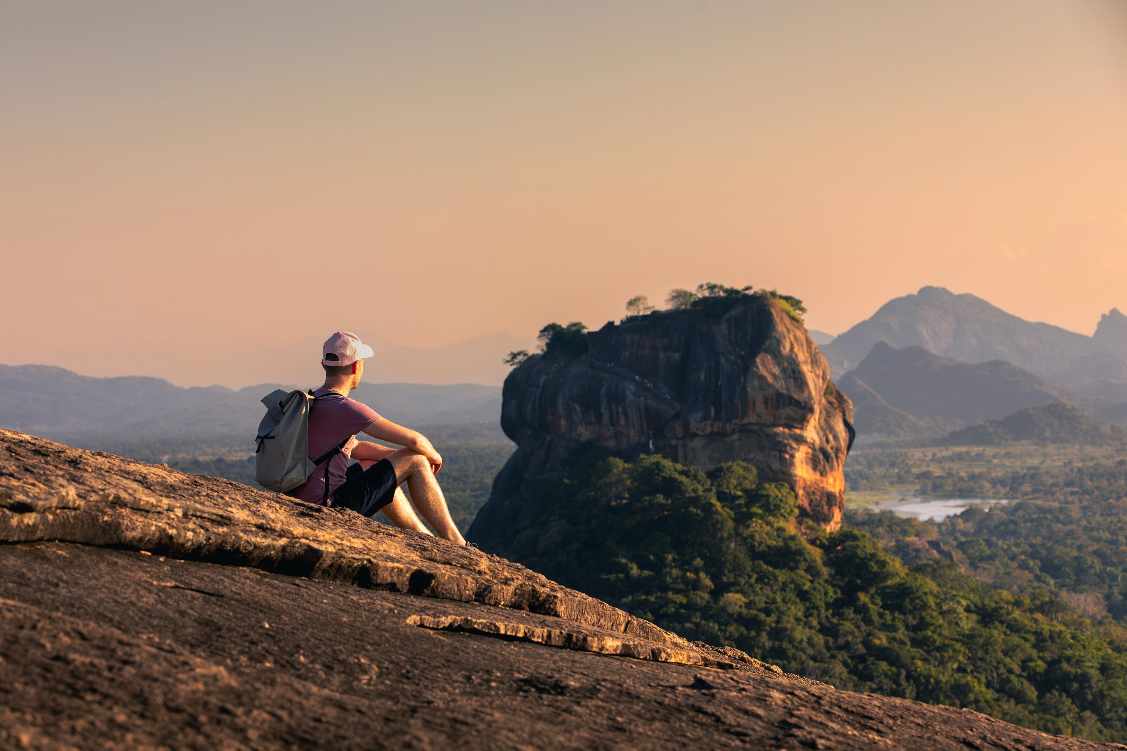 Sigiriya Lion Rock rising above the green forest at sunrise in Sri Lanka